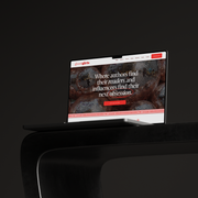 Laptop displaying a website on a dark background