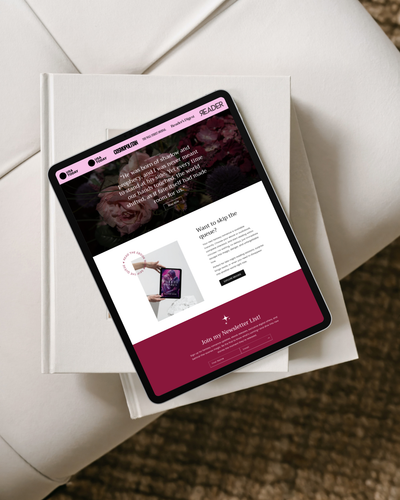 Tablet displaying a website on top of a book