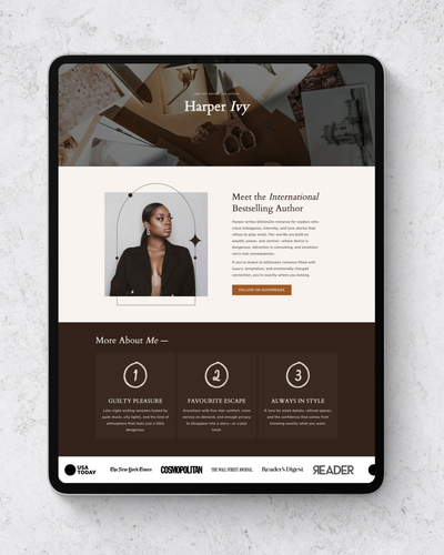 Tablet displaying a website about an international bestselling author on a textured white surface.