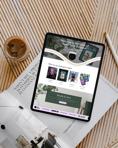 Tablet displaying a website on a wooden surface with a cup of coffee and a pen.