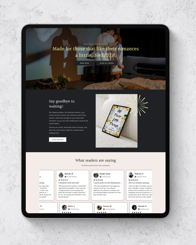 Tablet displaying a website with a romantic theme on a light gray surface