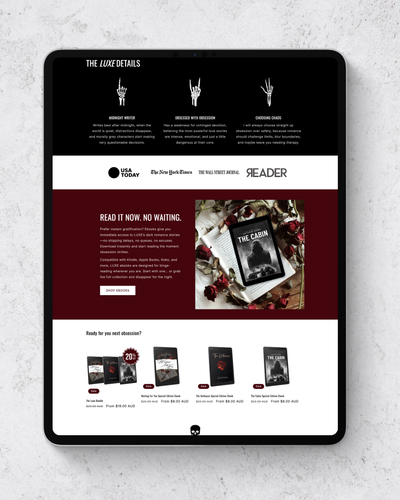 Digital tablet displaying a magazine website on a textured gray surface