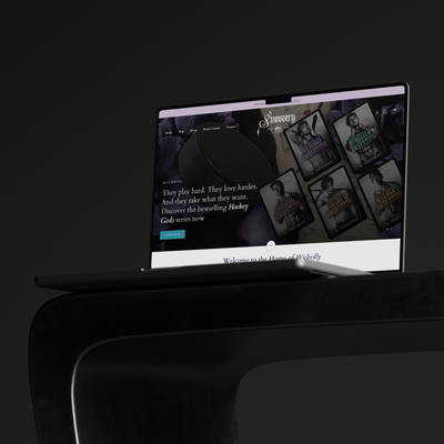 Laptop displaying a website on a dark background