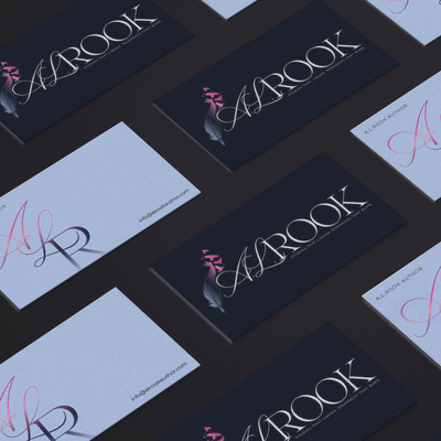 Multiple business cards with 'A.L.Rook' branding on a dark surface.