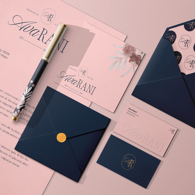 Stationery set with 'Ava Rani' author branding on pink and navy envelopes and cards.