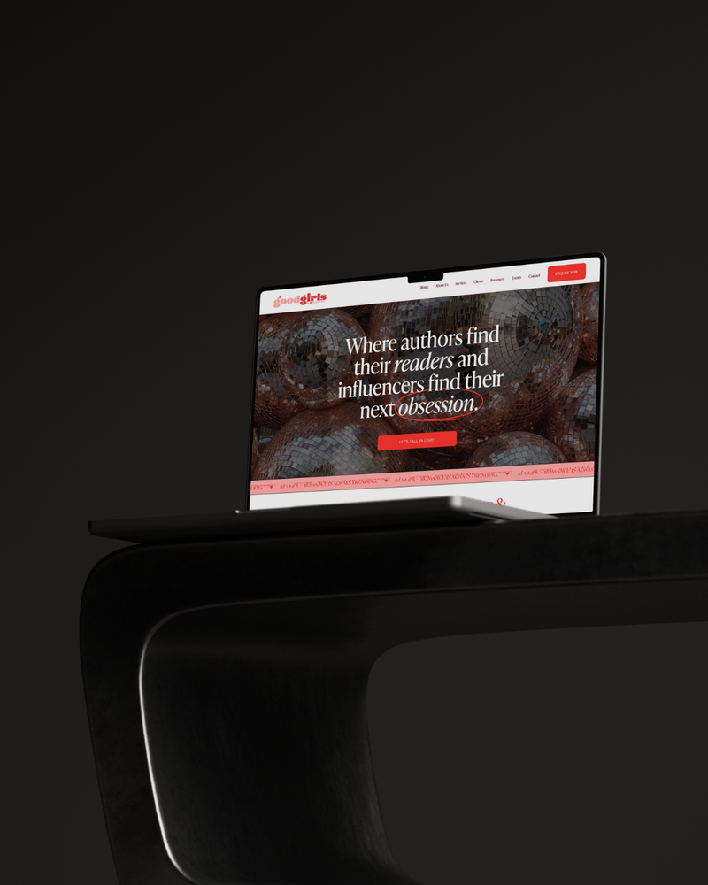 Laptop displaying a website on a dark surface