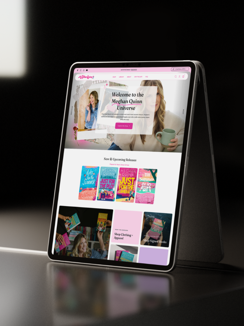 Tablet displaying a Meghan Quinns website on a dark surface