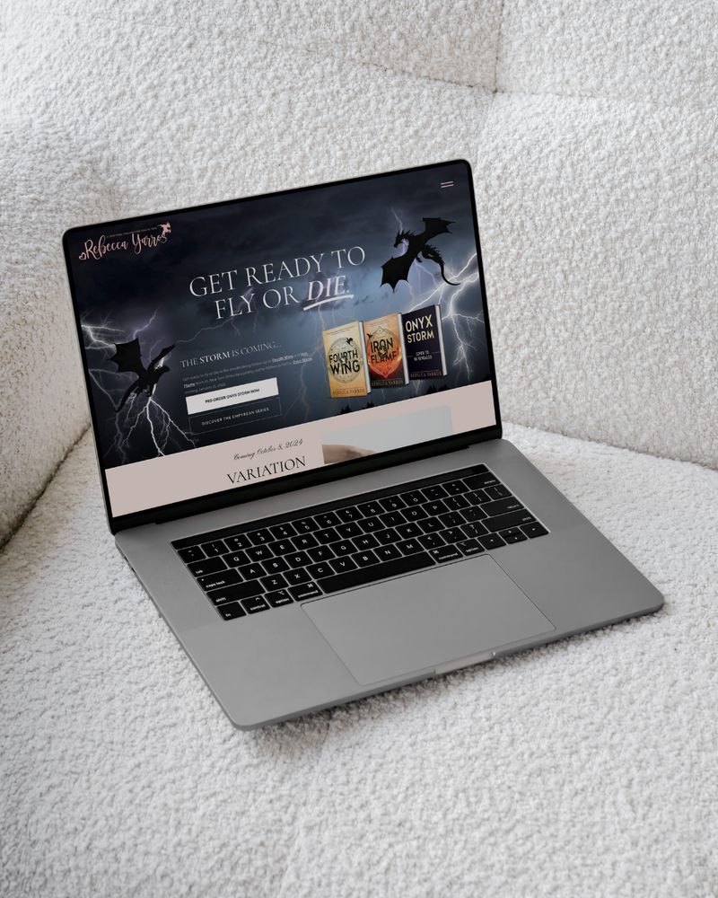 Laptop on a textured surface displaying a website with a dark theme.